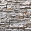 Flexible stone veneer featuring a rugged ledge stone design in neutral tones, perfect for an eye-catching decorative panel, interior wall, or exterior facade.