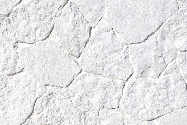 Field Stone 7 Elevate your space with flexible stone veneer in a bright white hue, featuring a natural, textured pattern ideal for an eye-catching interior wall or exterior facade.