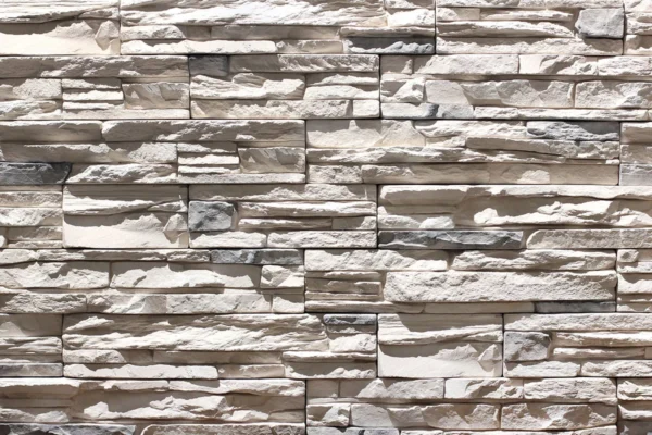 Ledge Stone 10 Flexible stone veneer in a light gray tone, featuring a rugged, textured ledgestone pattern perfect for an eye-catching interior wall or exterior facade.