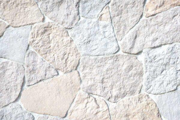 Field Stone 6 Flexible stone veneer in Field Stone pattern features a light, neutral color palette and rough texture, ideal for interior wall or exterior facade applications.