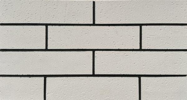 Split Brick 6 White split brick flexible stone veneer for interior walls, offering the look of traditional brick with easy installation and a lightweight design.
