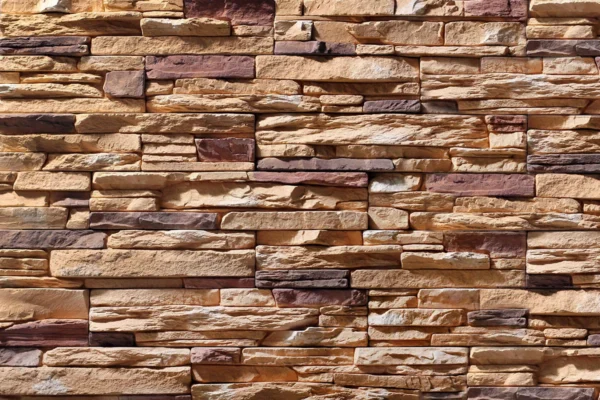 Ledge Stone 1 Durable flexible stone veneer in earthy brown tones with a rugged, textured pattern, perfect for a sophisticated interior wall or exterior facade.