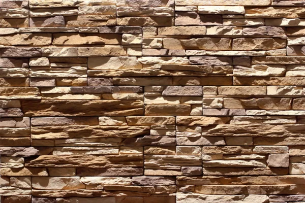 Ledge Stone 8 Flexible stone veneer in warm brown and tan tones with a rugged texture, ideal for an eye-catching interior wall or durable exterior facade.