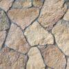 Flexible stone veneer in earth tones with a rugged texture creates a natural and durable wall cladding for both interior and exterior applications.