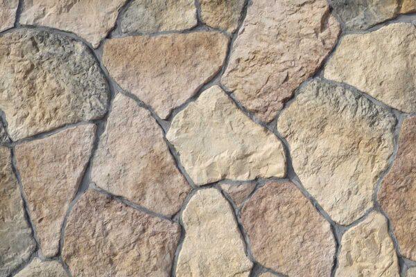 Field Stone 3 Flexible stone veneer in earth tones with a rugged texture creates a natural and durable wall cladding for both interior and exterior applications.
