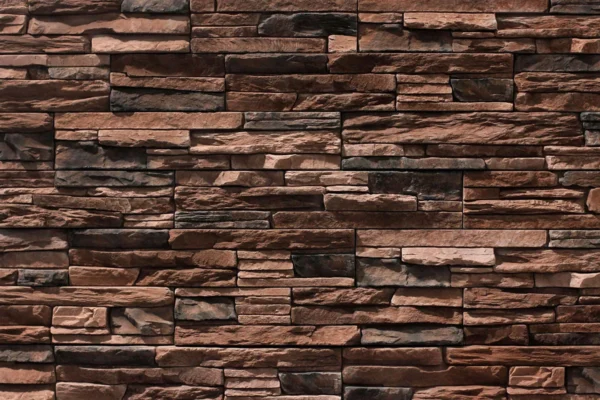 Ledge Stone 6 Flexible stone veneer in earth tones with a rugged texture, ideal for creating a natural-looking interior wall or stunning exterior facade. Contact us!