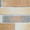 Split brick flexible stone veneer in shades of tan, gray, and cream with a textured finish, ideal for an interior wall cladding.
