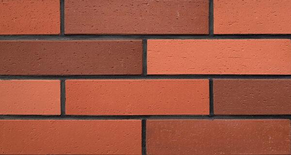 Split Brick 2 Split brick flexible stone veneer in rustic red tones, perfect for an interior wall or exterior facade with a classic brick appearance.