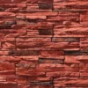 Flomary Ledge Stone flexible stone veneer in red hues showcases a rugged texture and organic pattern, ideal for an eye-catching interior wall or exterior facade.