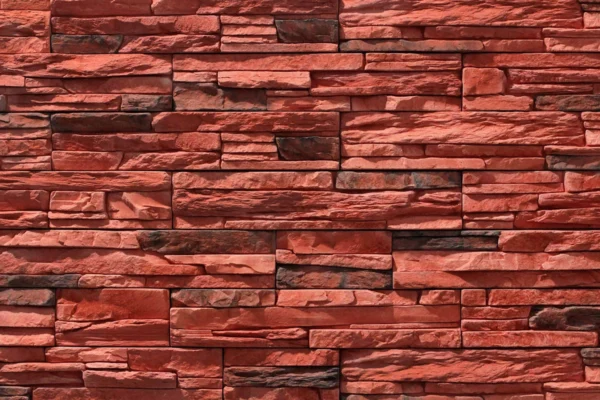 Ledge Stone 12 Flomary Ledge Stone flexible stone veneer in red hues showcases a rugged texture and organic pattern, ideal for an eye-catching interior wall or exterior facade.