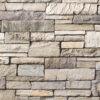 Ashfall Country Ledgestone flexible stone veneer features earth-toned colors, a rugged texture, and a natural stacked pattern, ideal for interior wall and exterior facade applications.
