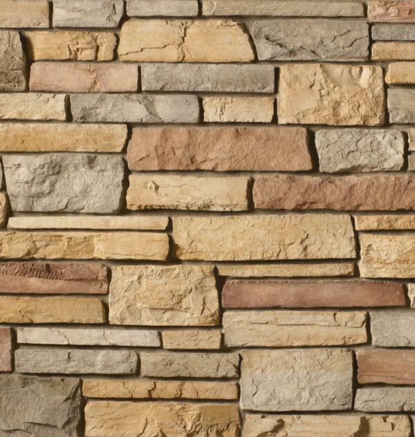 Flexible stone veneer in caramel tones with a natural ledgestone texture, ideal for adding a touch of rustic elegance to any interior wall or exterior facade.