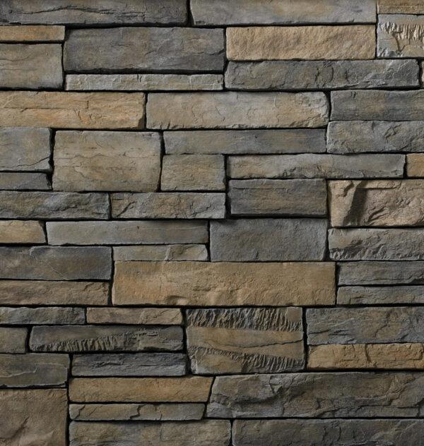 Flexible stone veneer in Skyline color with a country ledgestone pattern, ideal for interior walls and exterior facades, offering the timeless look of castle stone.