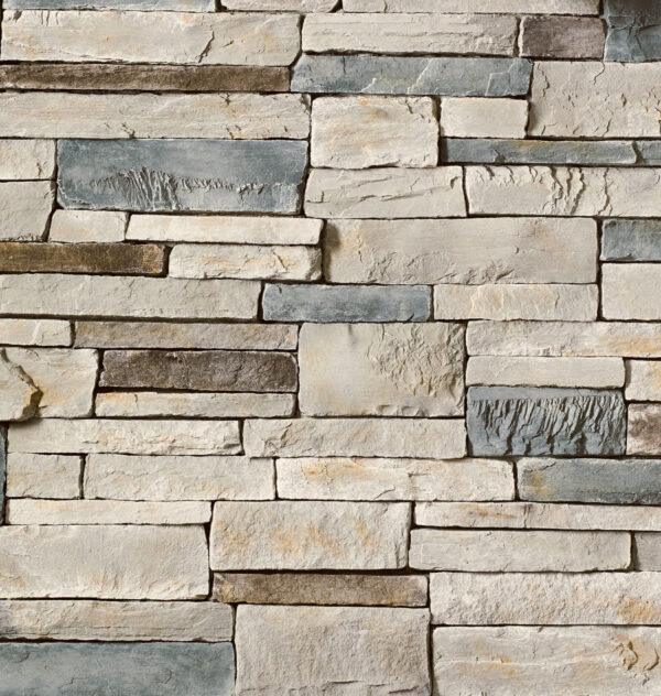 Flexible stone veneer in Echo Ridge showcases a multi-tone blend of gray, beige, and brown hues for interior walls or exterior facades, contact sales for details.