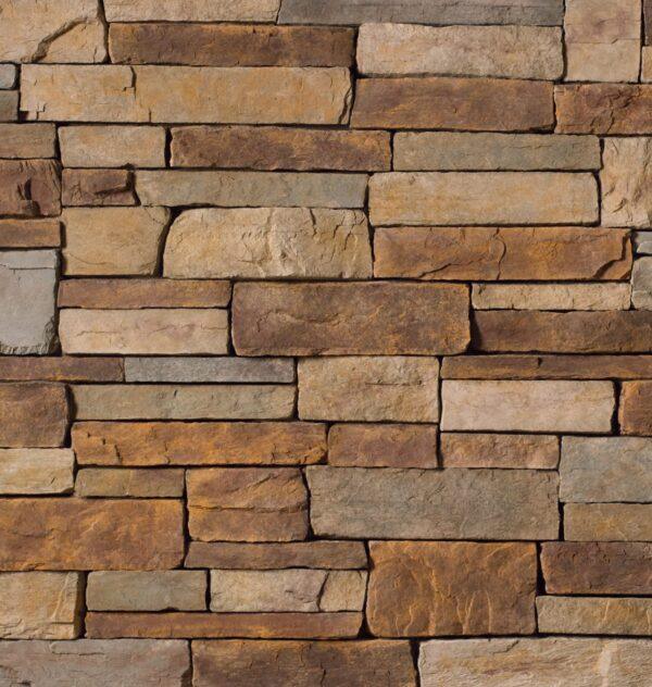 Flexible stone veneer featuring a country ledgestone pattern in Sevilla tones, perfect for adding a touch of rustic charm to any interior wall or exterior facade.