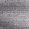 Flexible stone veneer featuring a linear pattern in a light gray shade, ideal for a modern interior wall or unique exterior facade. Contact us today!