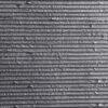 Square Line Stone flexible veneer in dark gray with a horizontal striped texture, ideal for modern interior wall cladding or exterior facade design.