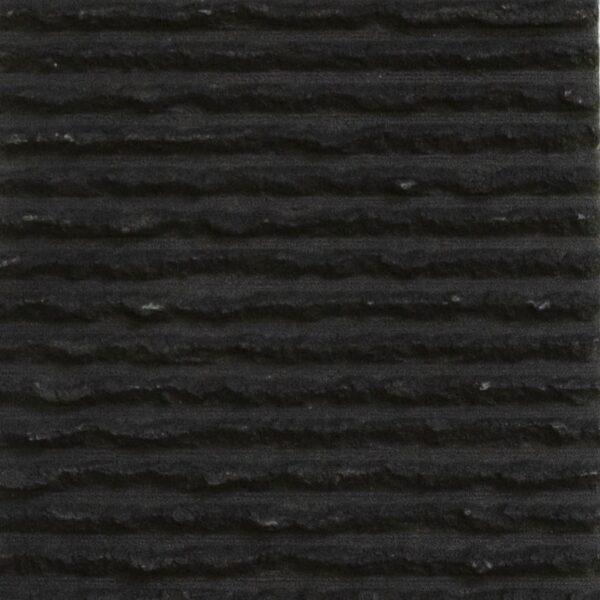 Round Line Stone 5 Flexible stone veneer with a dark gray, horizontally lined texture, ideal for modern interior wall cladding or a sophisticated exterior facade project.