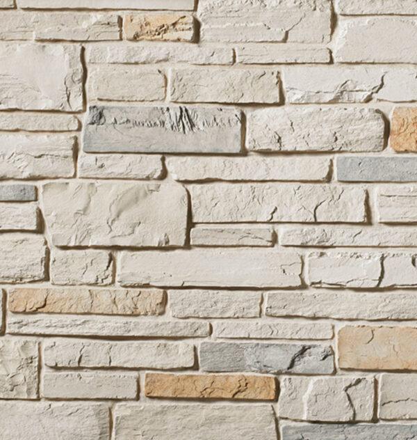 Flexible stone veneer in white oak color with a natural ledgestone texture, perfect for an interior wall or exterior facade to add a castle stone look.