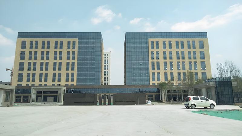 Institute building facade finished with flexible tiles