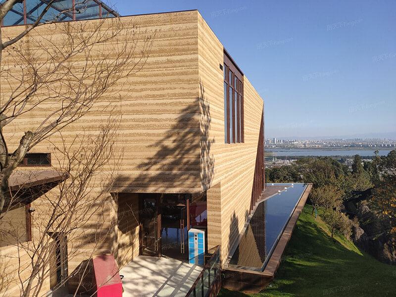 Home exterior wall cladding with flexible tiles