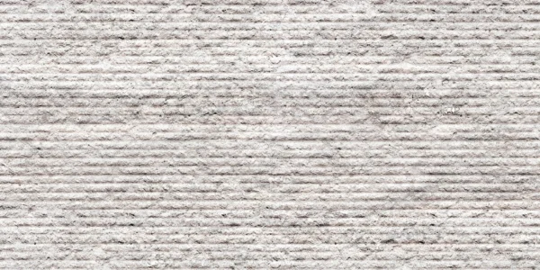 Stone Ridged flexible stone veneer featuring a textured, linear pattern in a light gray finish, ideal for modern interior wall cladding or exterior facade.